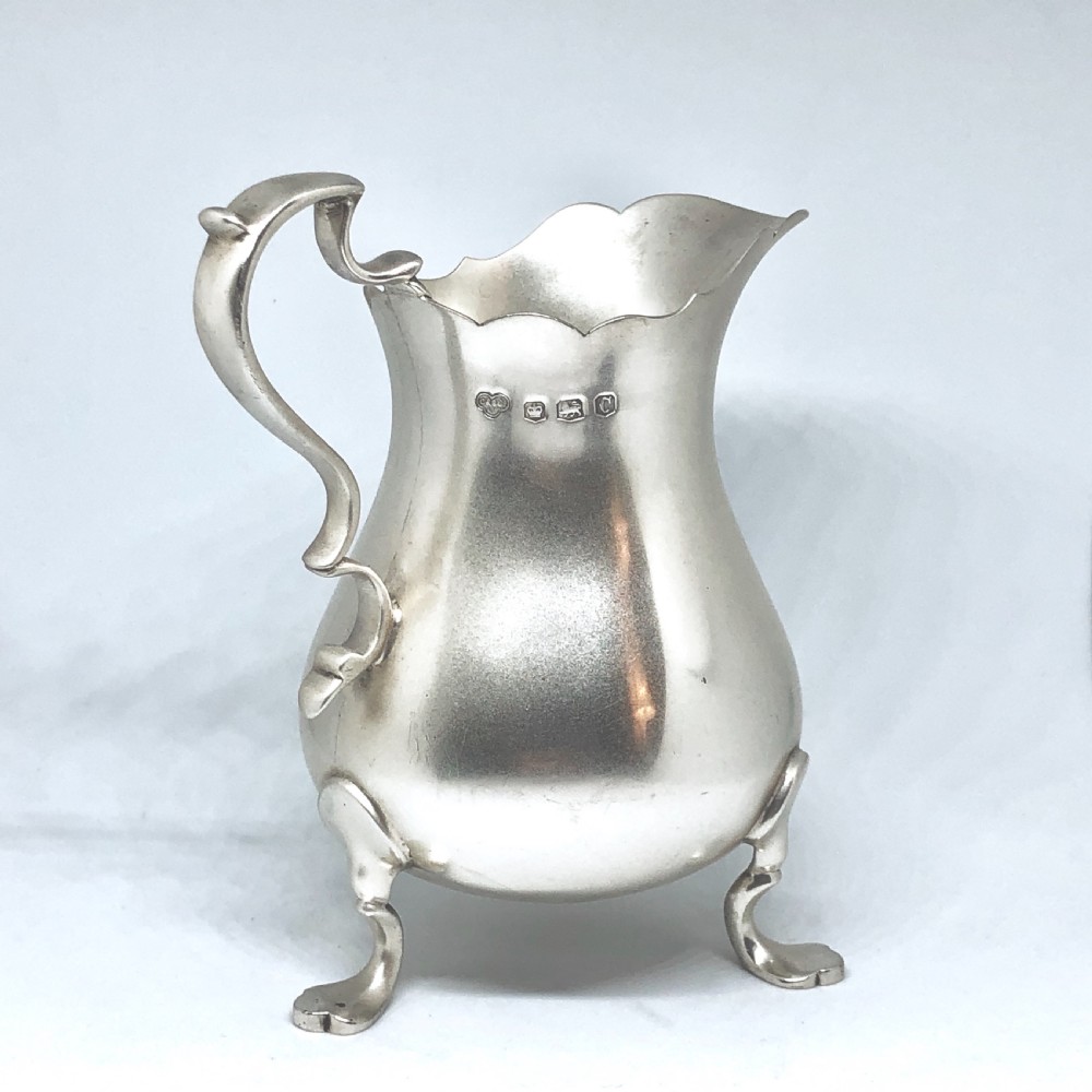 A silver baluster shaped milk jug  View III