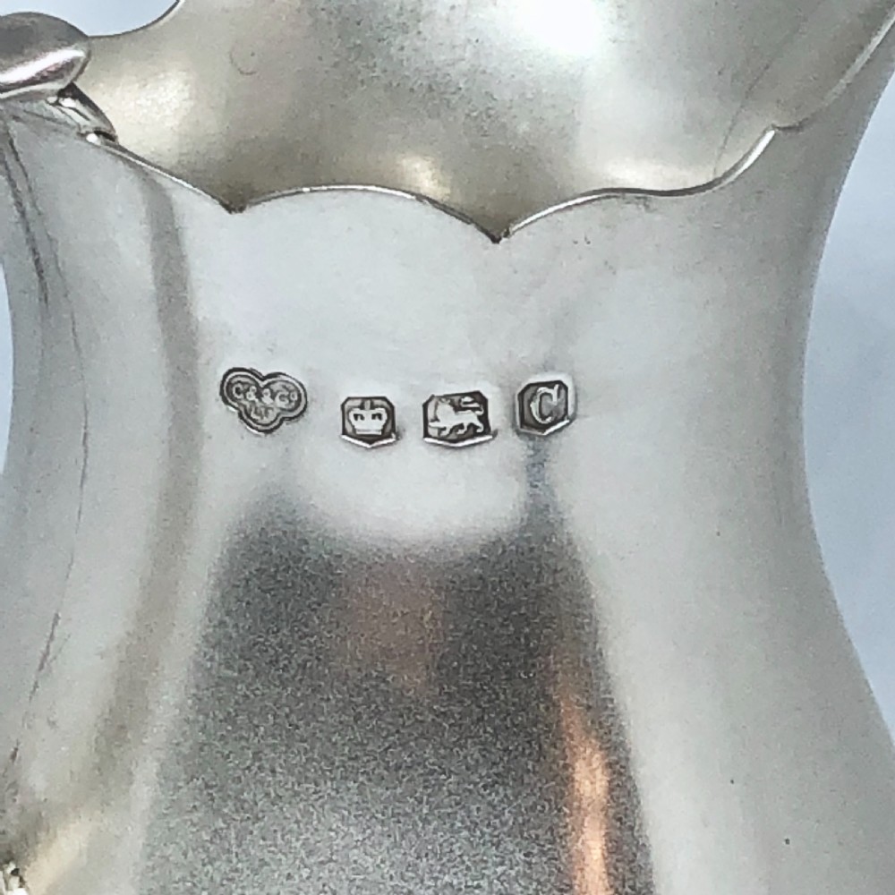 A silver baluster shaped milk jug  View V