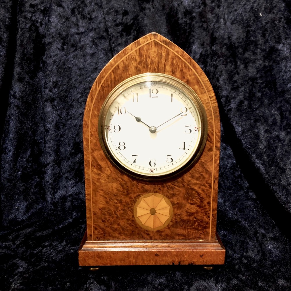 An Edwardian burr walnut mantel clock 