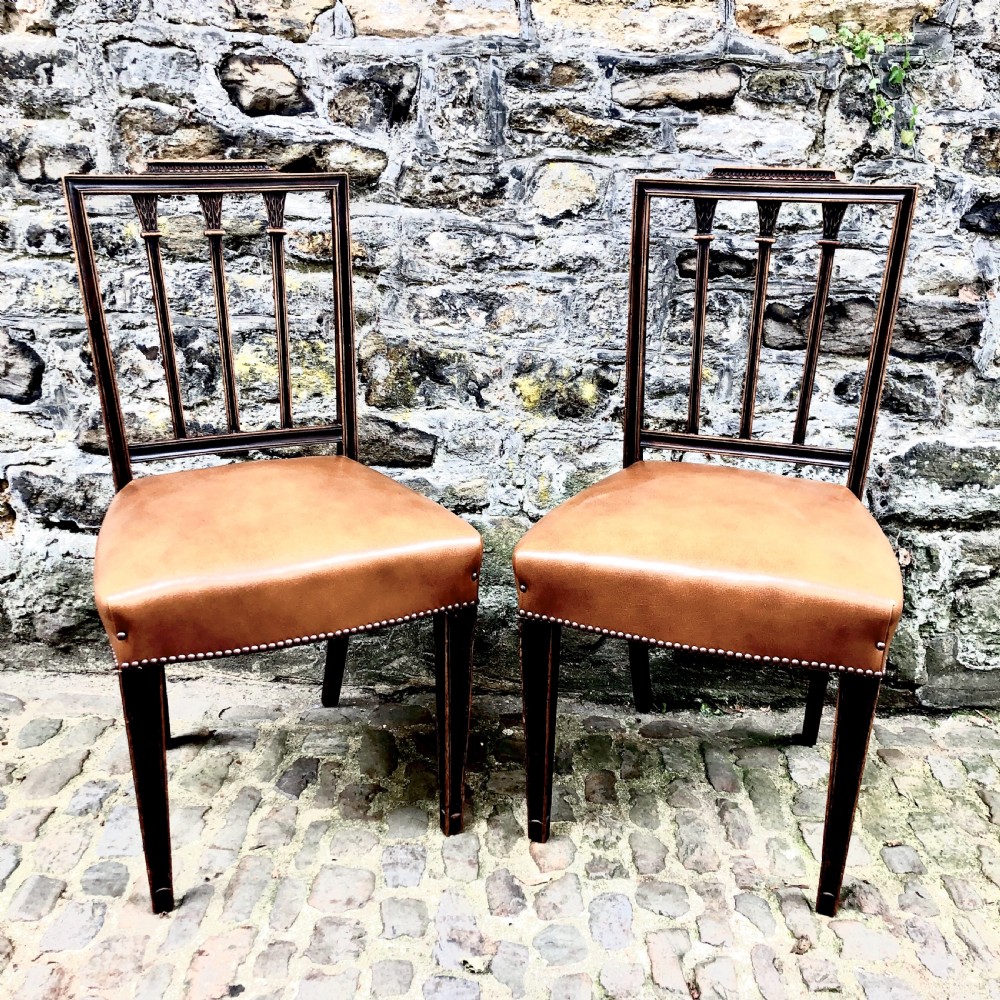 A set of four Sheraton Revival mahogany dining chairs  View II