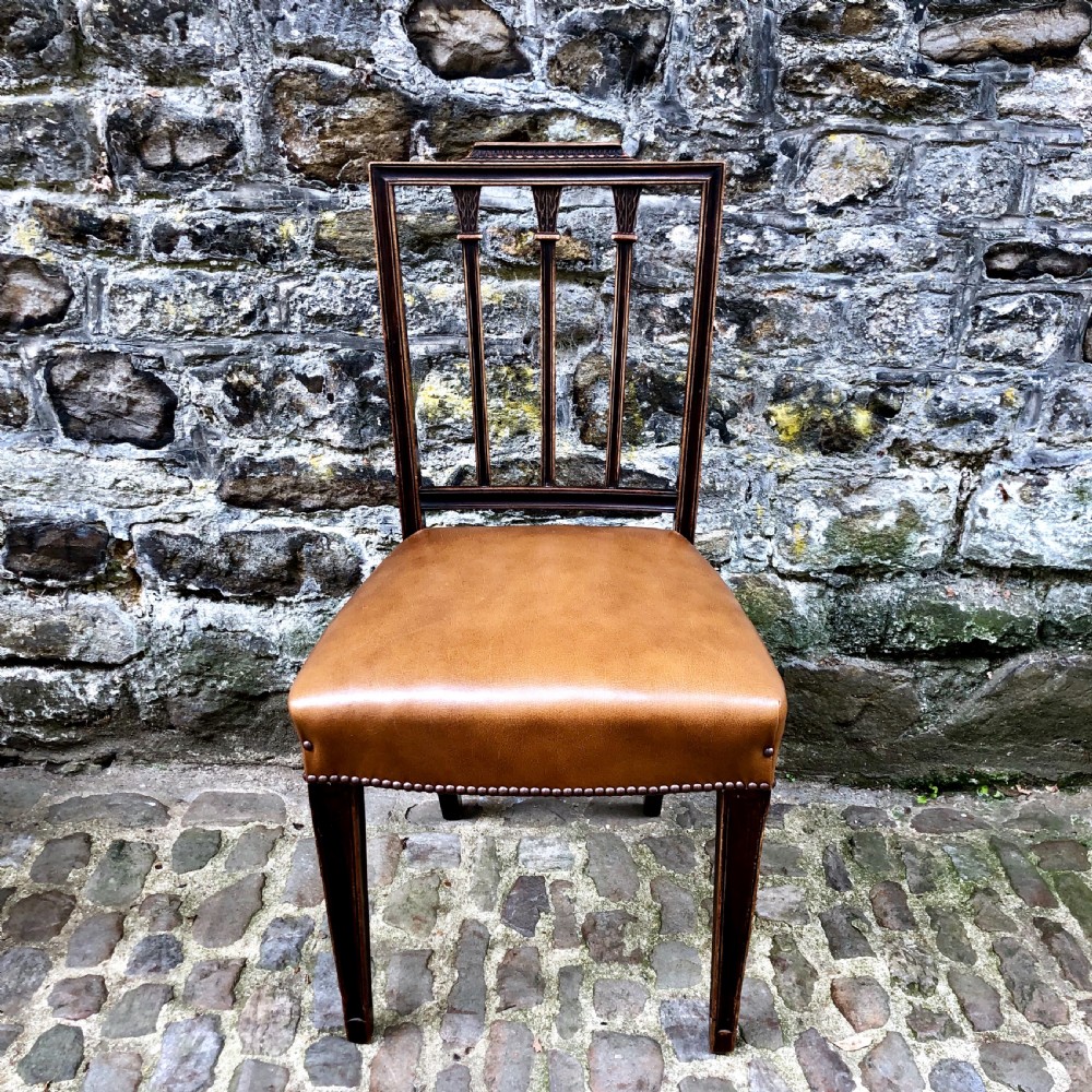 A set of four Sheraton Revival mahogany dining chairs  View III