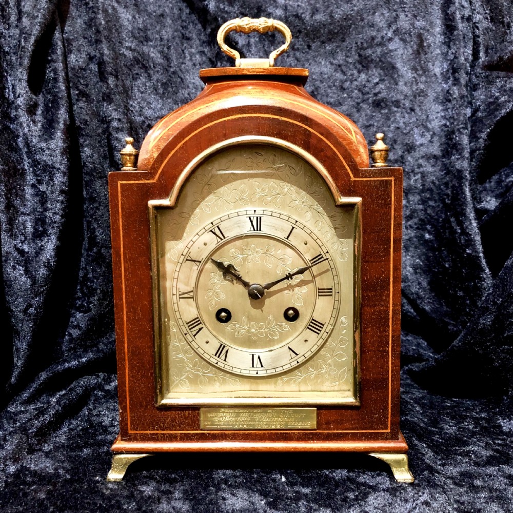 A small Edwardian mahogany mantel clock 