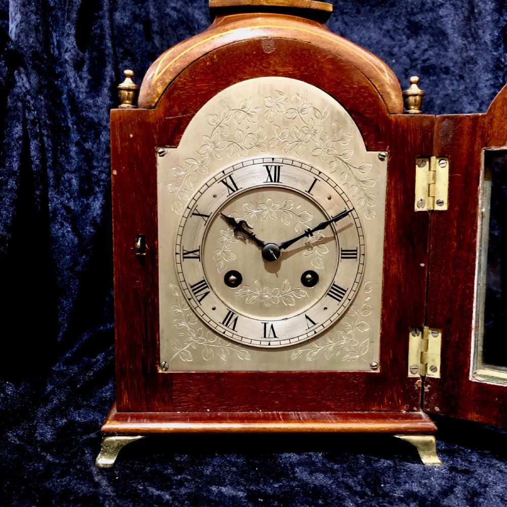 A small Edwardian mahogany mantel clock  View VI