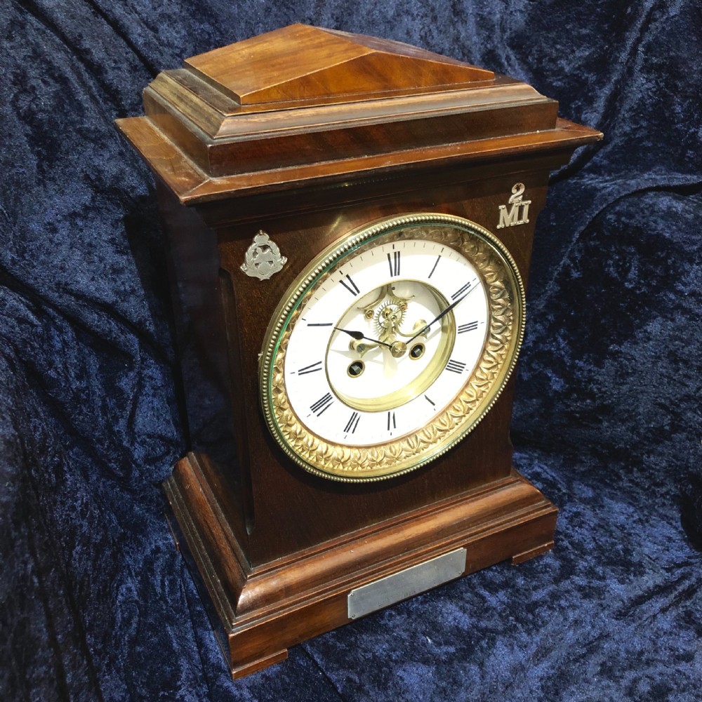 A late 19th century mahogany table clock with military interest.  View II