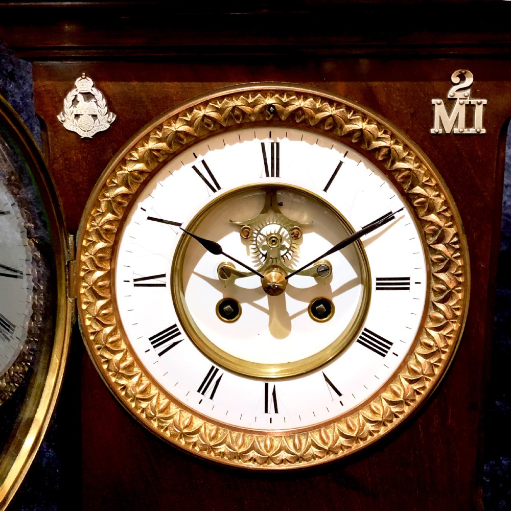 A late 19th century mahogany table clock with military interest.  View III