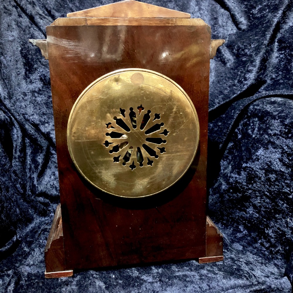 A late 19th century mahogany table clock with military interest.  View IV