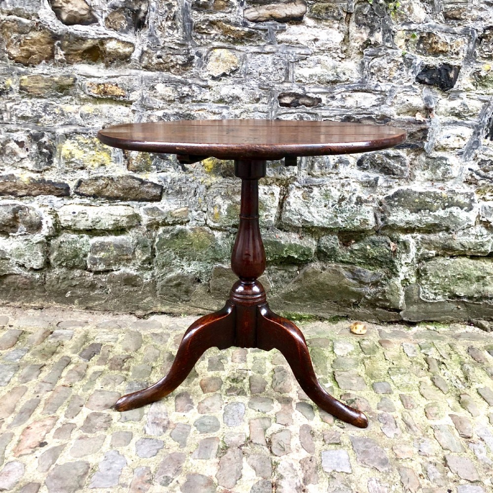 An early George III oak tripod table  View III