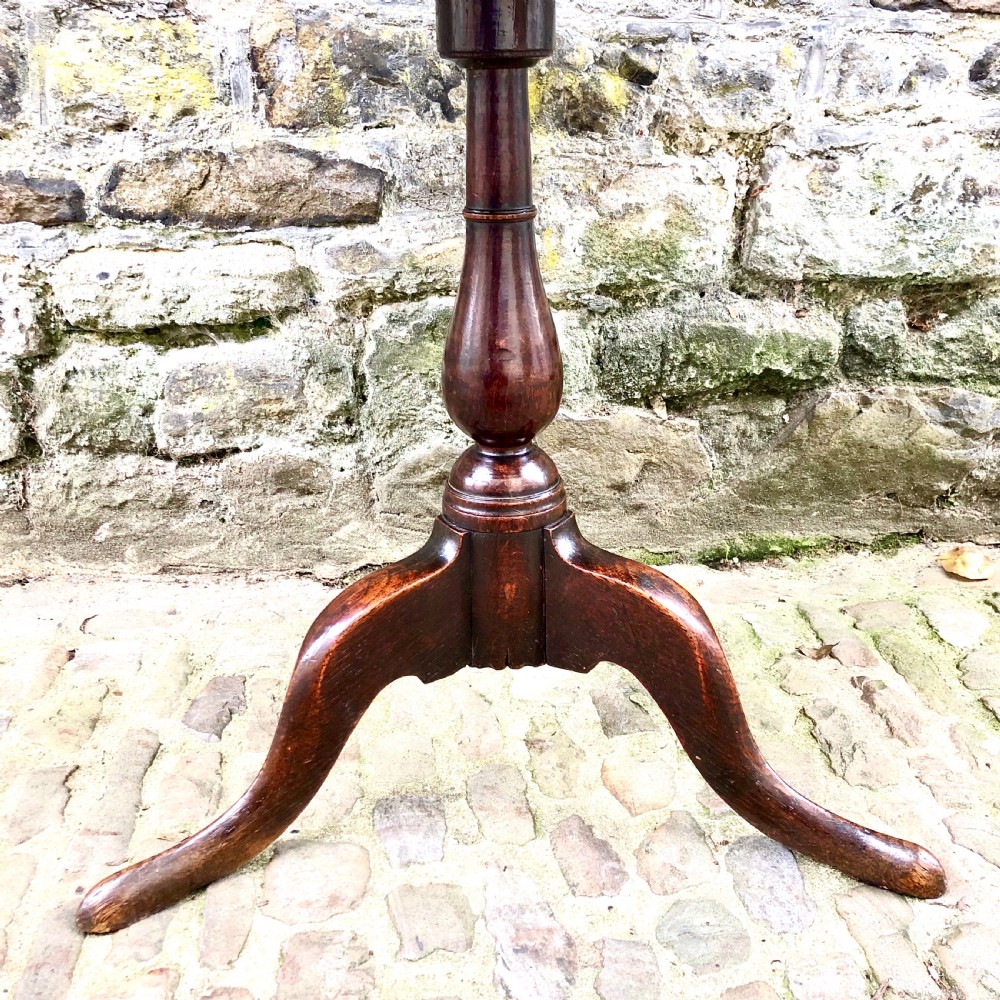 An early George III oak tripod table  View IV