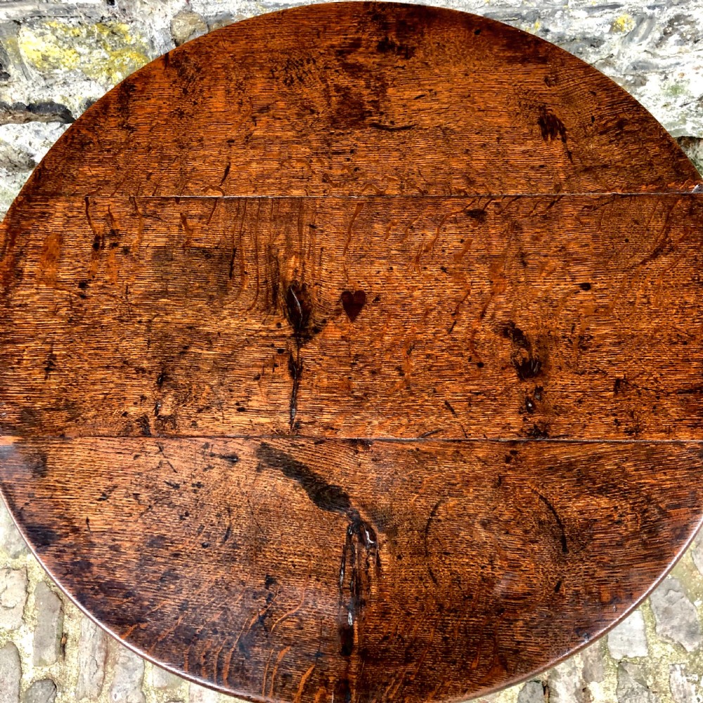 An early George III oak tripod table  View VI