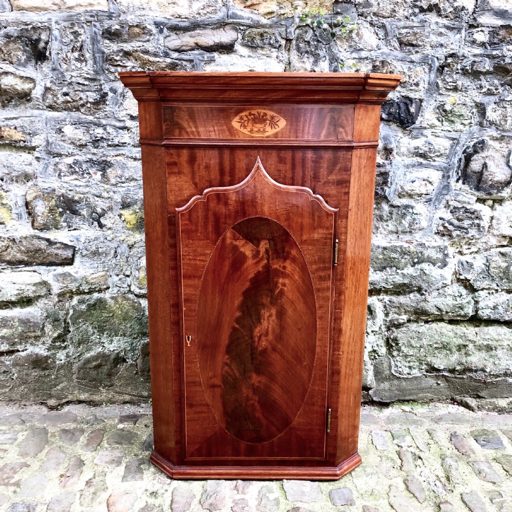 A small 19th century mahogany corner cupboard 