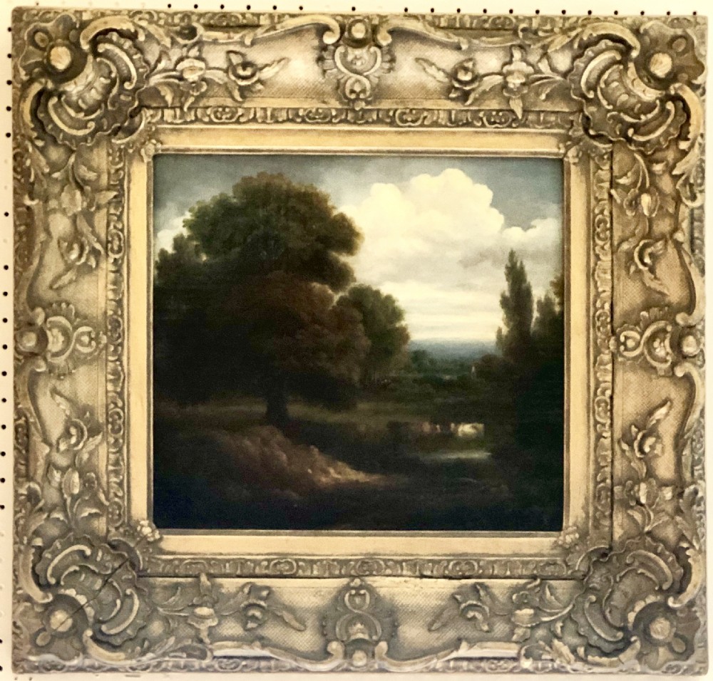 A 19th century oil painting on canvas of cattle in a landscape 
