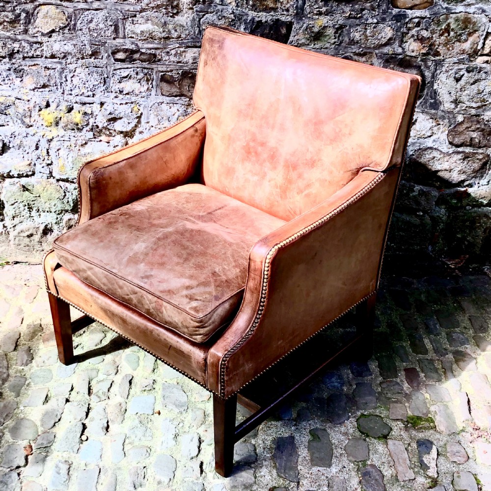 An Edwardian leather and mahogany armchair  View II