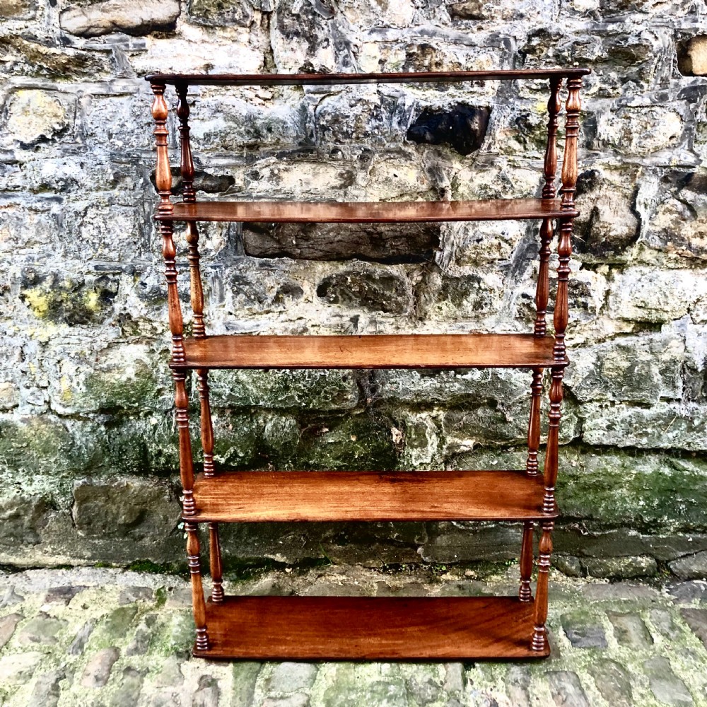 A George IV set of mahogany hanging shelves  View III