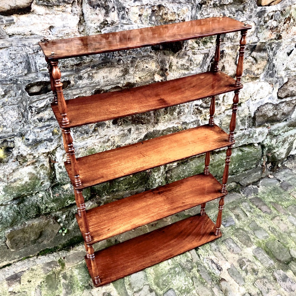 A George IV set of mahogany hanging shelves  View IV
