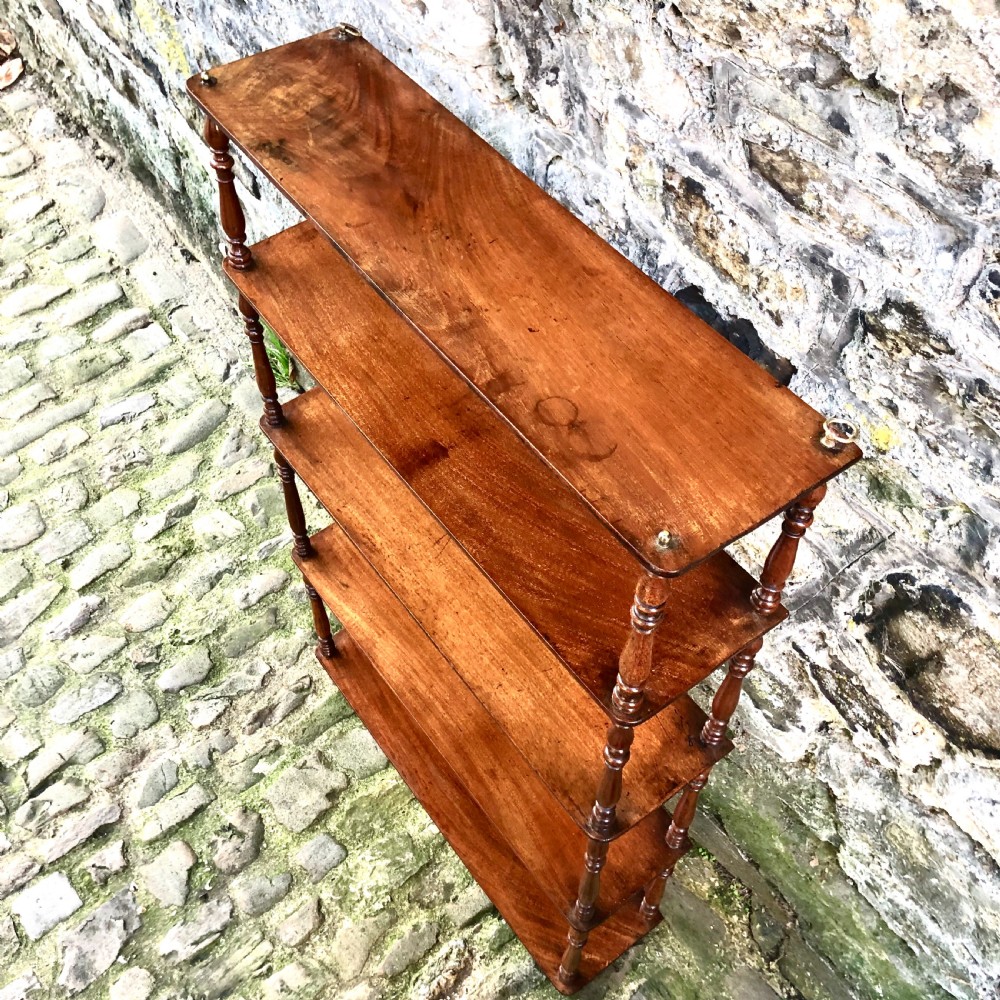 A George IV set of mahogany hanging shelves  View V
