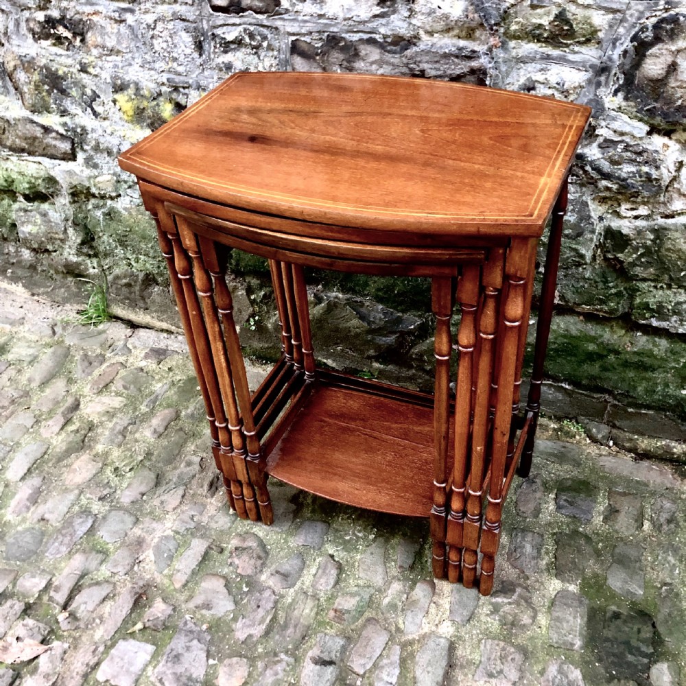 An Edwardian nest of four mahogany side tables  View III