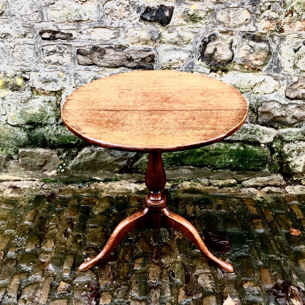 A George III oak tripod wine table 