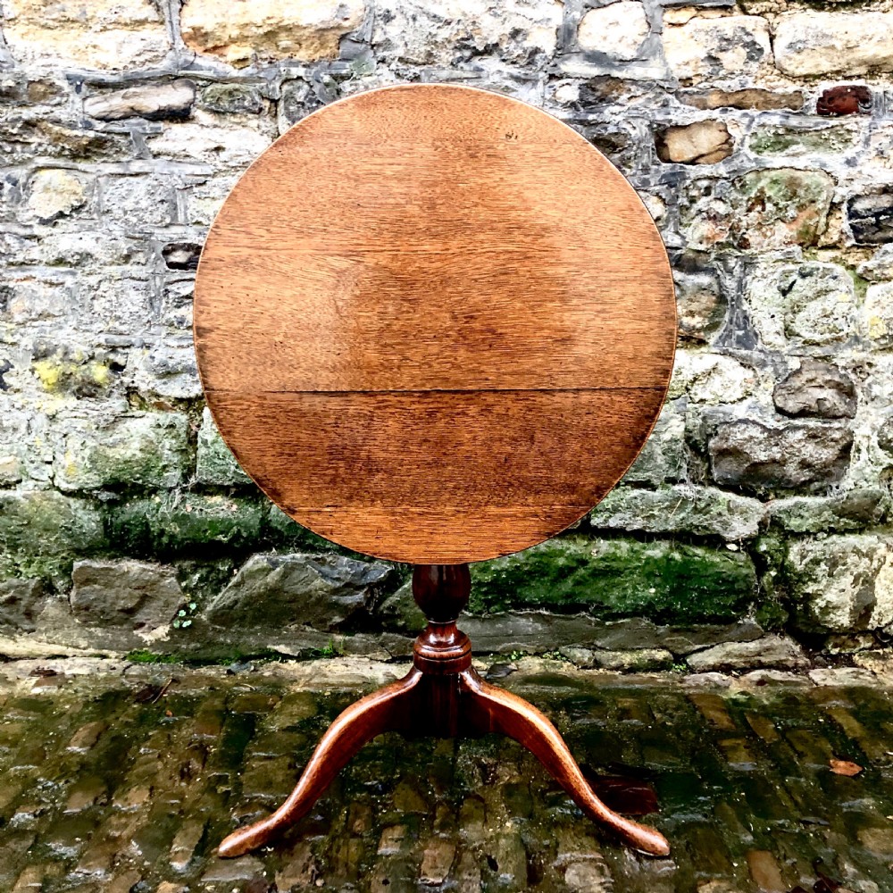 A George III oak tripod wine table  View II