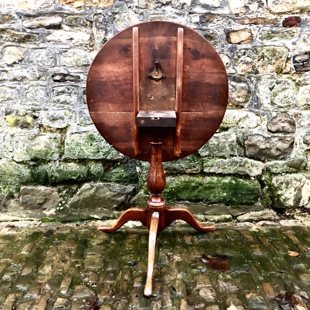 A George III oak tripod wine table  View IV