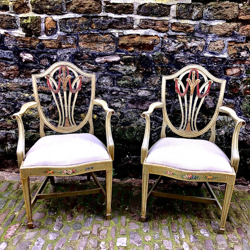 A pair of painted Sheraton Revival elbow chairs 