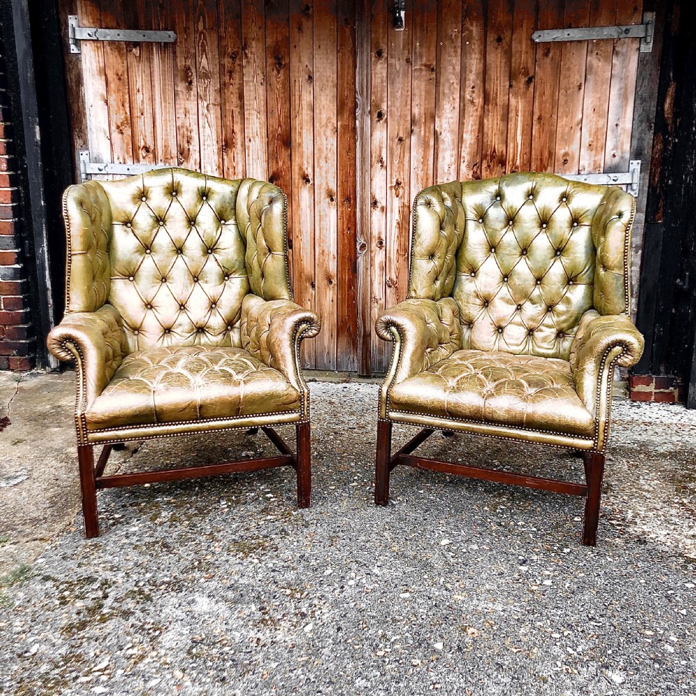 A pair of leather wing armchairs  View III