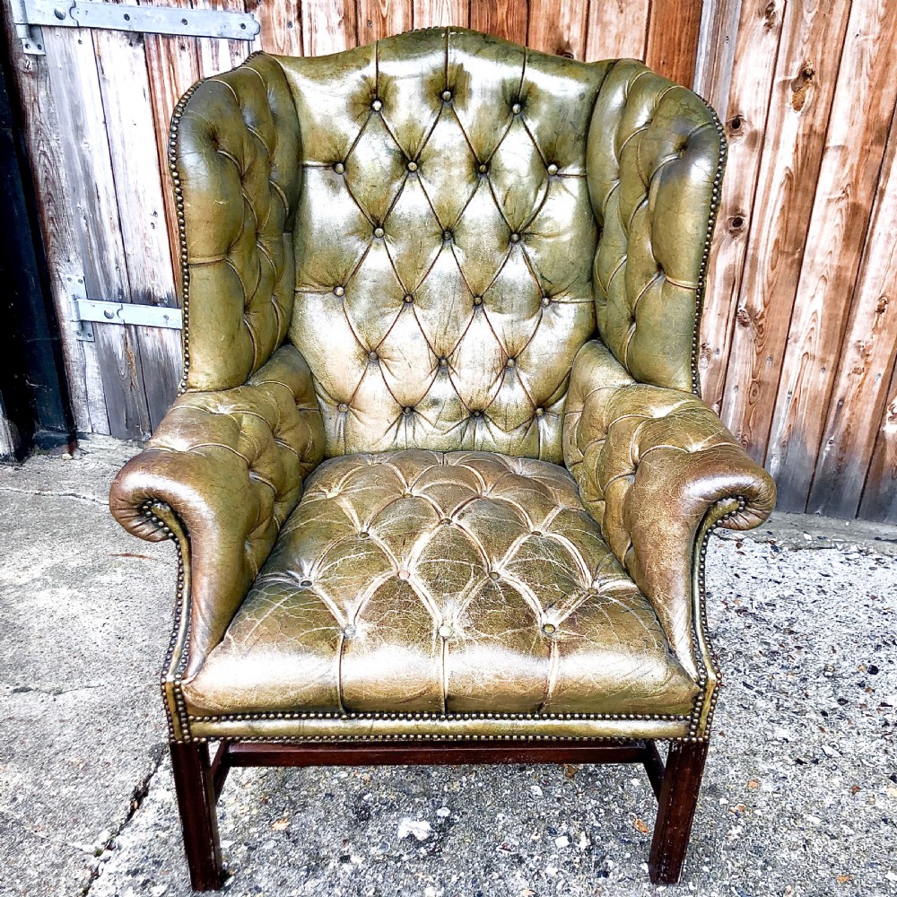 A pair of leather wing armchairs  View VI