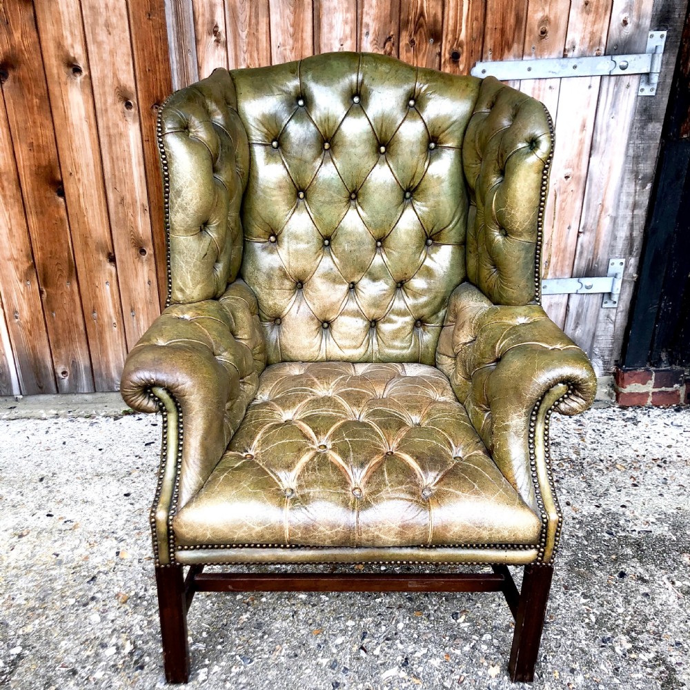 A pair of leather wing armchairs  View VII
