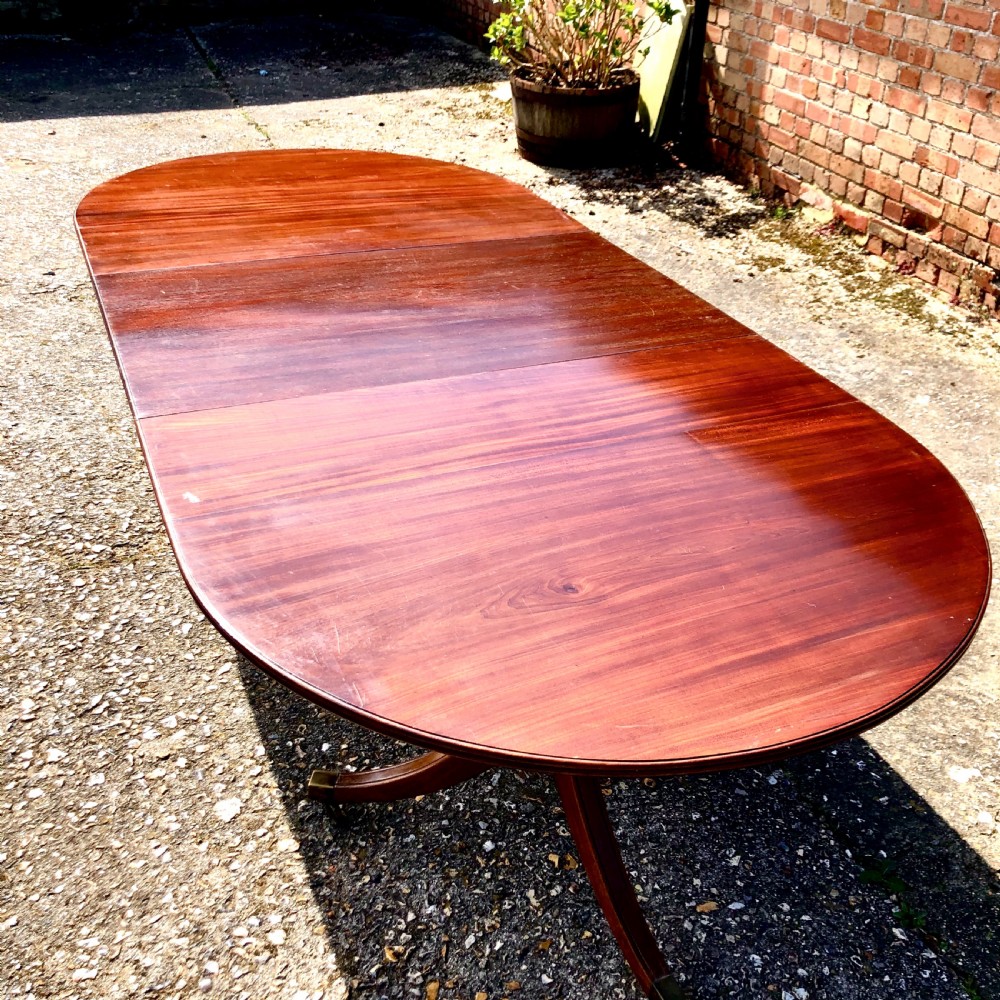 An Edwardian mahogany twin pedestal dining table 