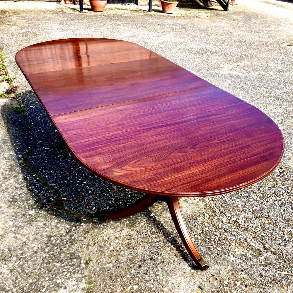 An Edwardian mahogany twin pedestal dining table  View III