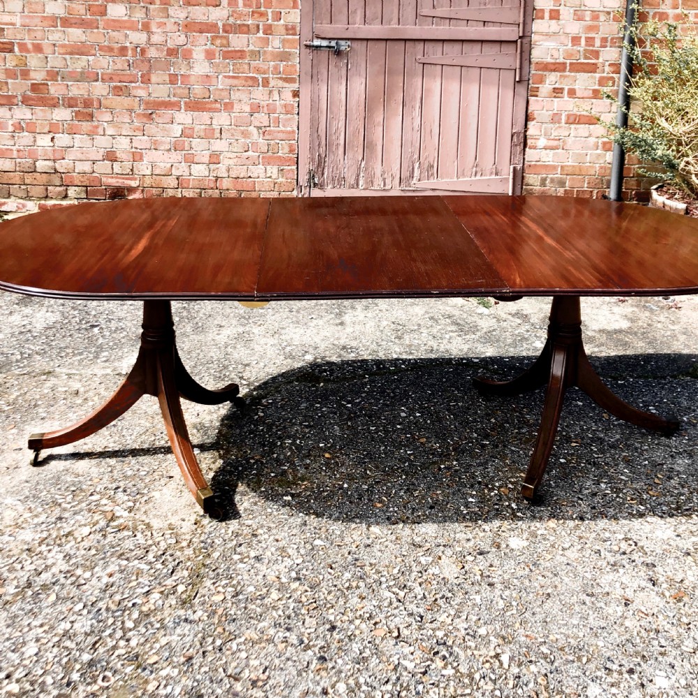 An Edwardian mahogany twin pedestal dining table  View IV