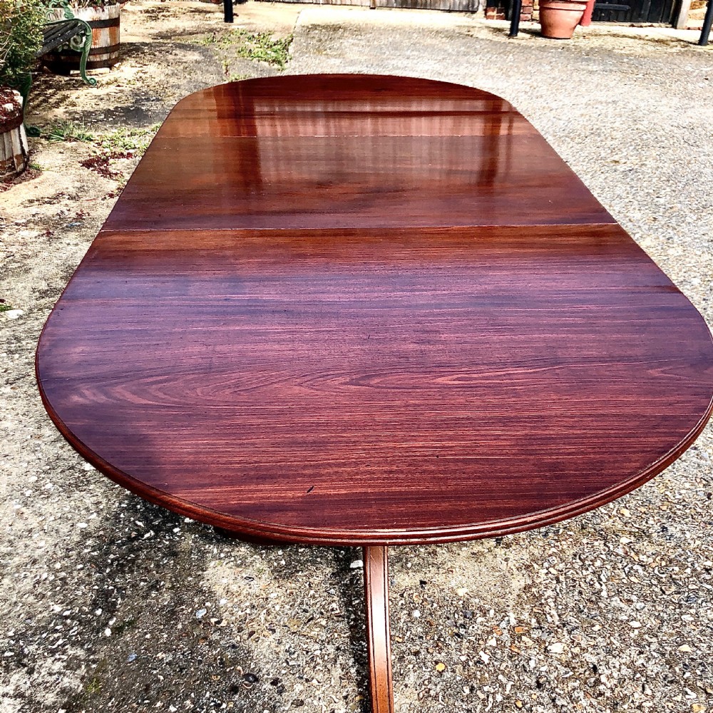 An Edwardian mahogany twin pedestal dining table  View V