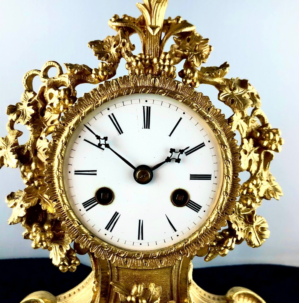 A Louis Philippe gilt bronze mantel clock by Raingo Frères  View II