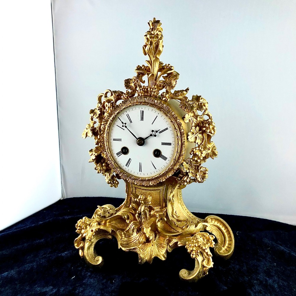 A Louis Philippe gilt bronze mantel clock by Raingo Frères  View III