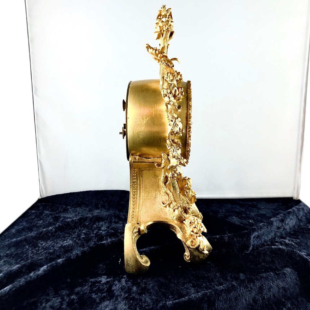 A Louis Philippe gilt bronze mantel clock by Raingo Frères  View V