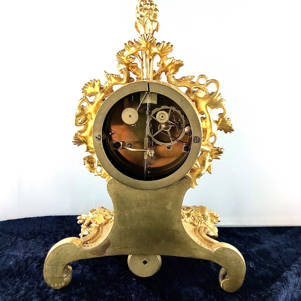 A Louis Philippe gilt bronze mantel clock by Raingo Frères  View X