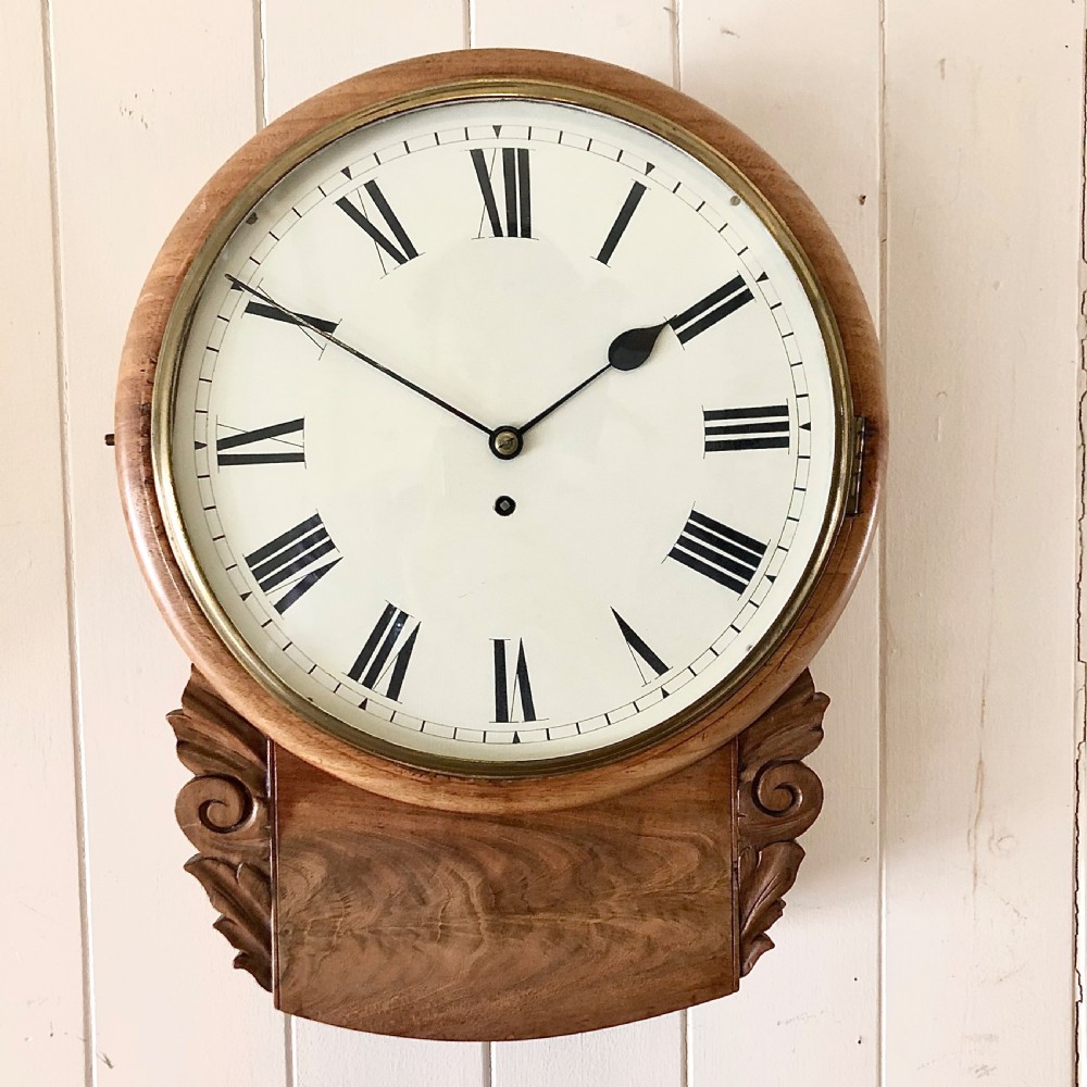 An early Victorian mahogany drop dial wall clock