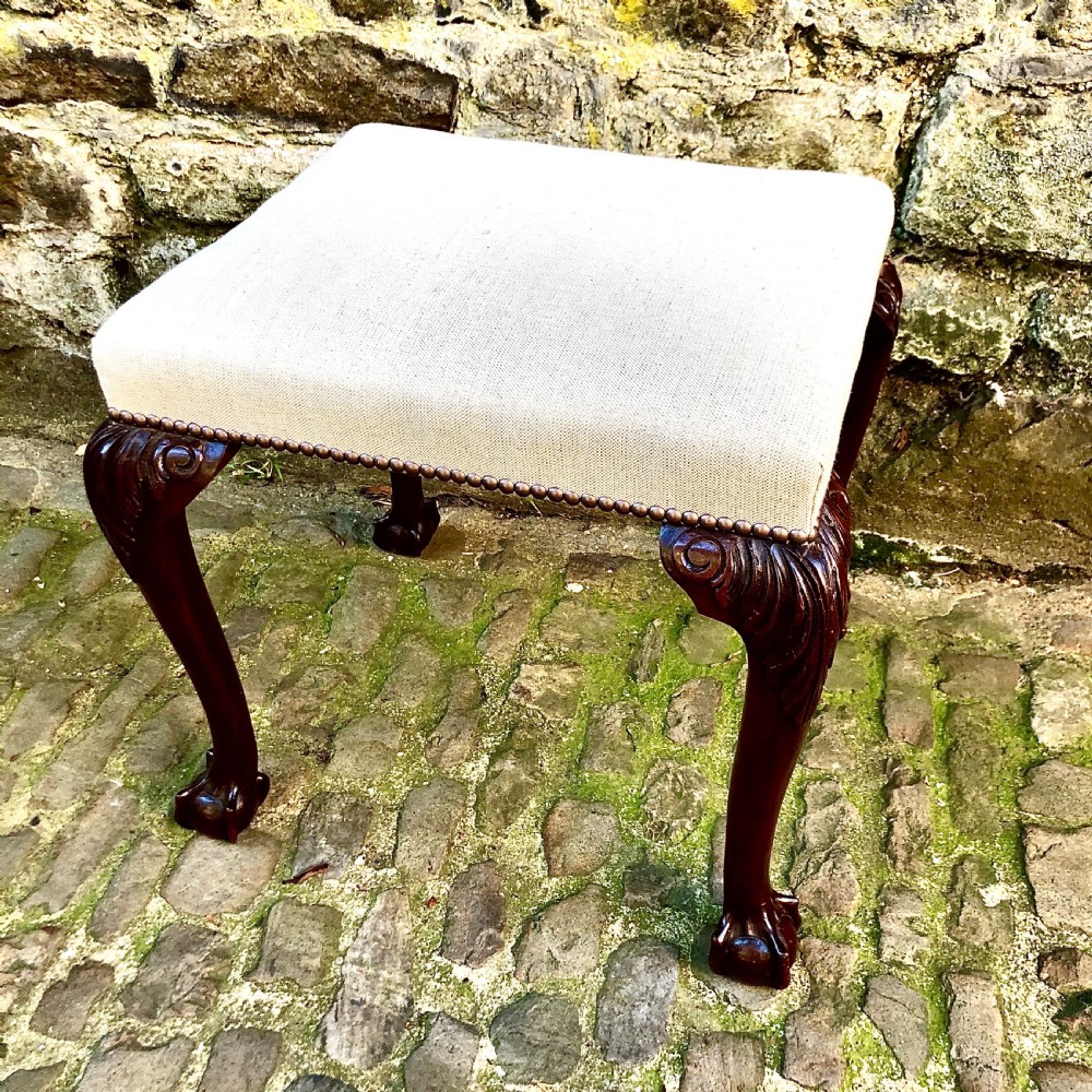 A late 19th century mahogany stool in the George II style View II