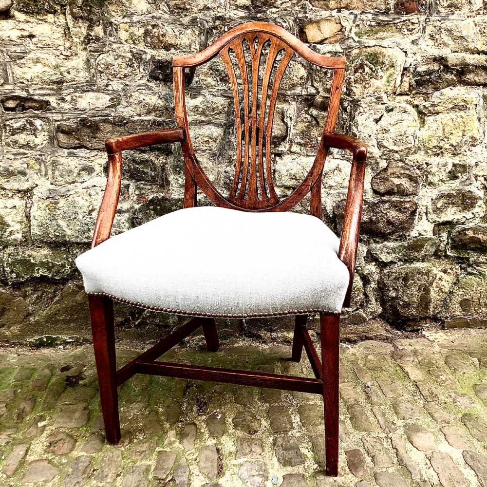 A George III elm shield back elbow chair