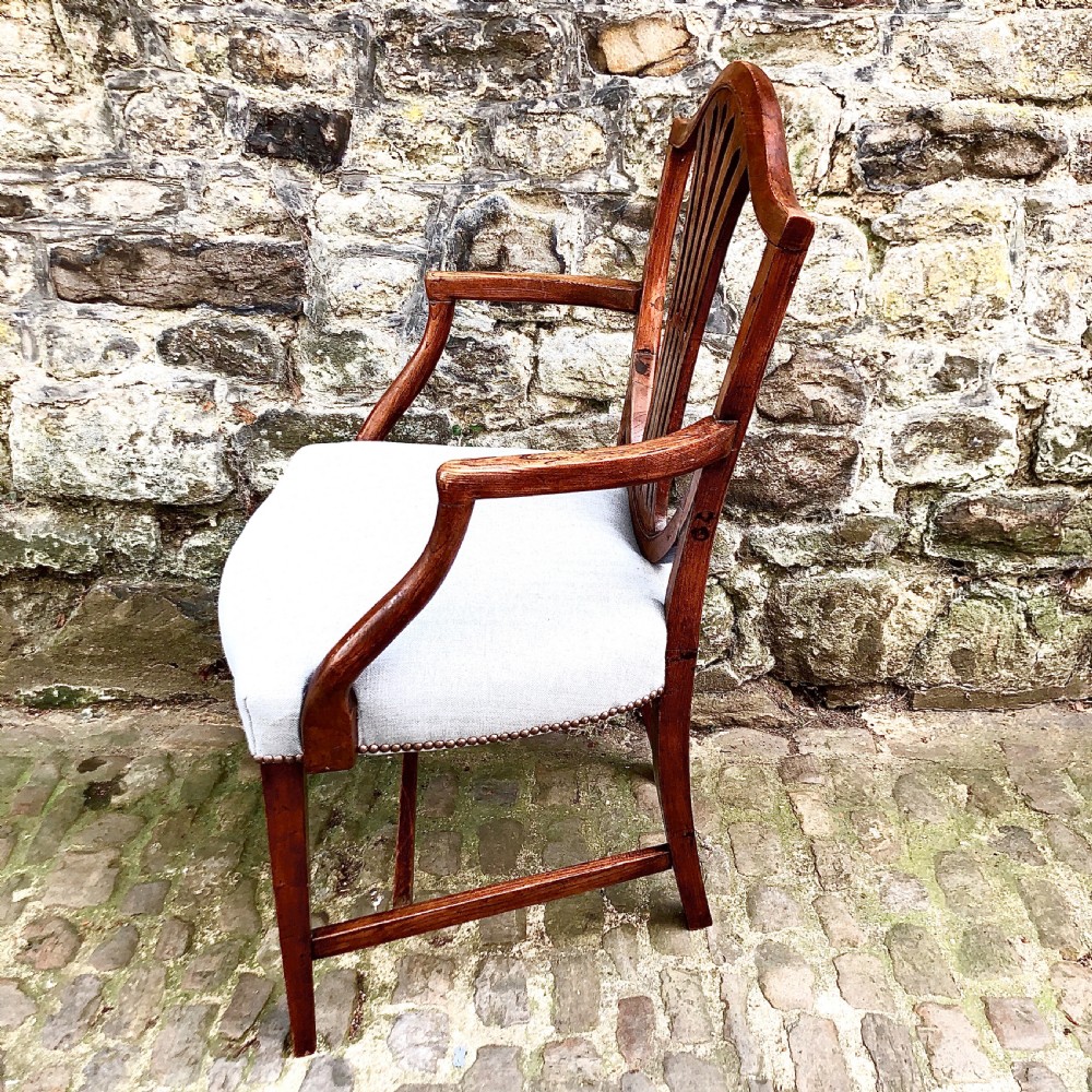 A George III elm shield back elbow chair View III
