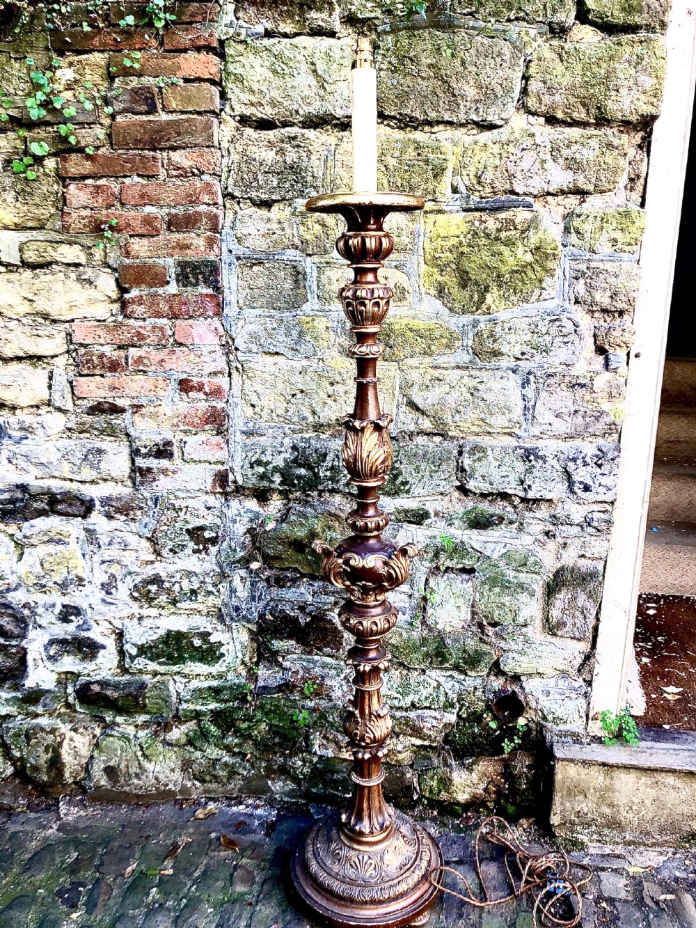 An early 20th century carved giltwood standard lamp 