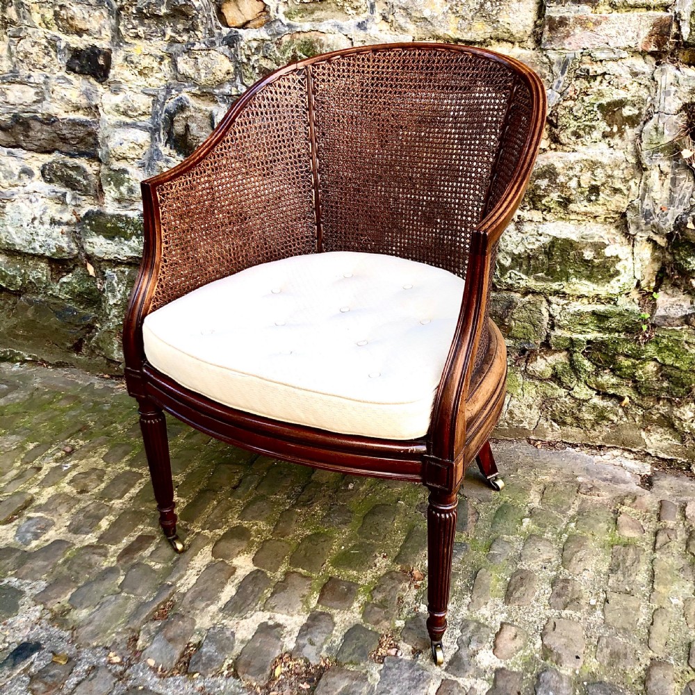 A George IV mahogany bergère chair