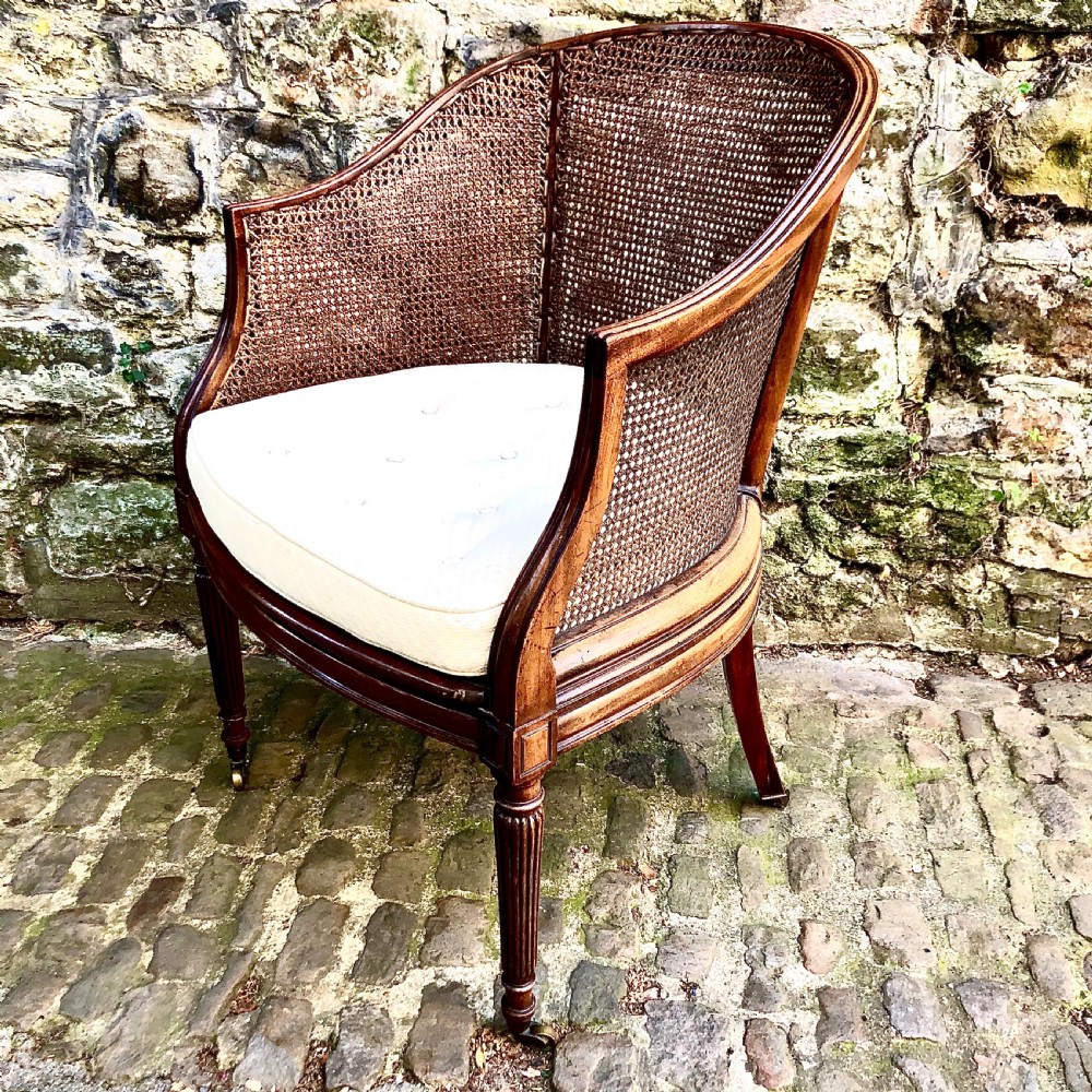 A George IV mahogany bergère chair View II