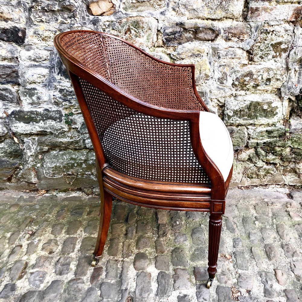 A George IV mahogany bergère chair View III