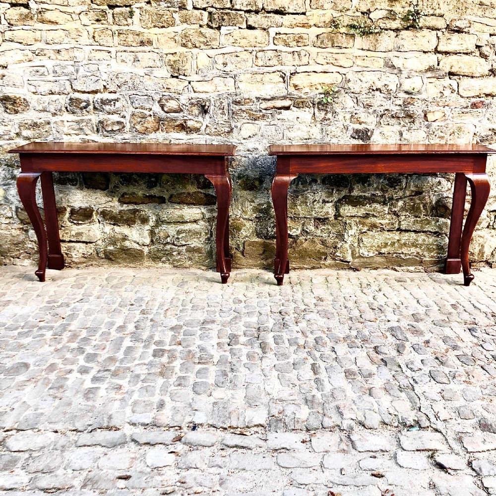 A pair of late 19th century mahogany console tables 