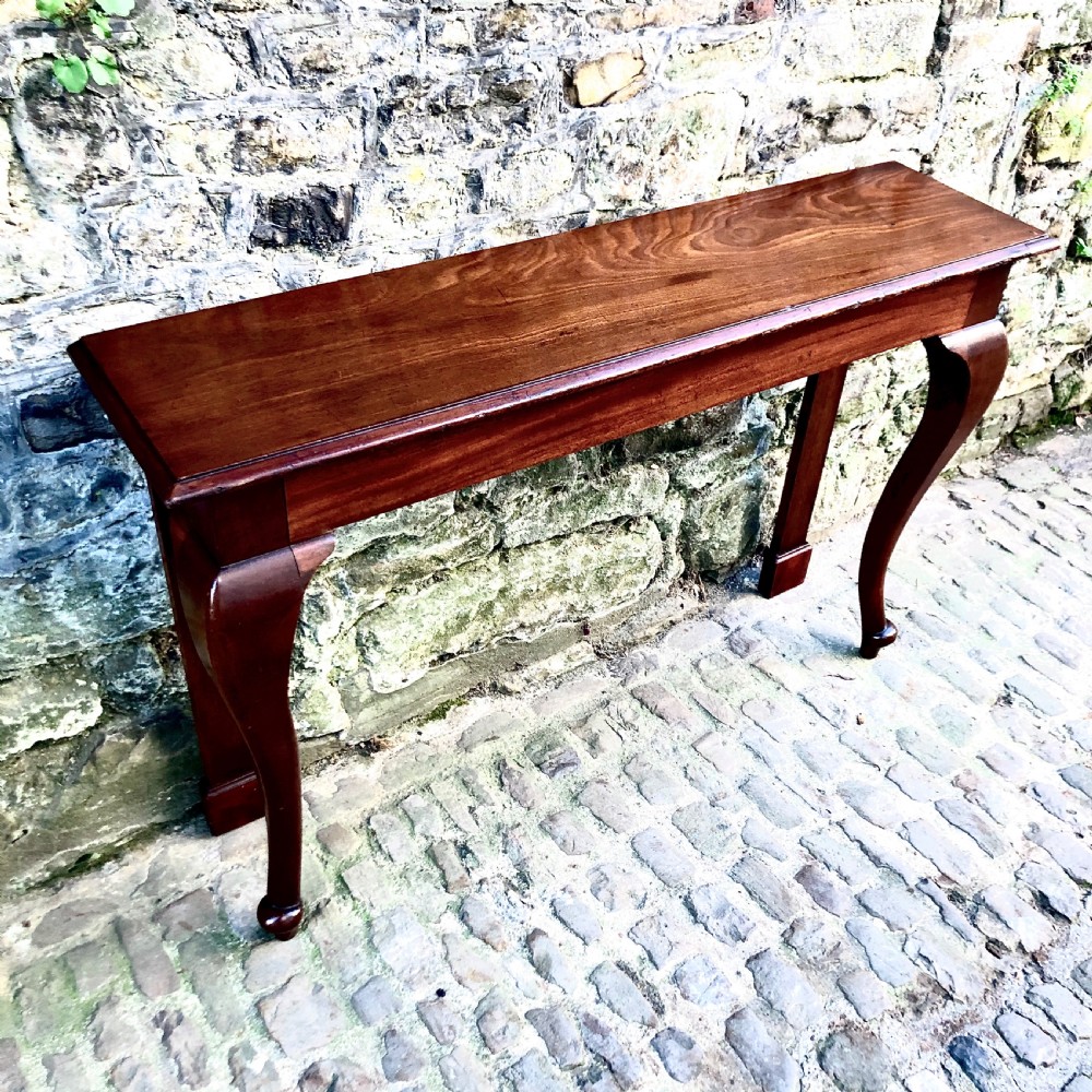 A pair of late 19th century mahogany console tables  View II