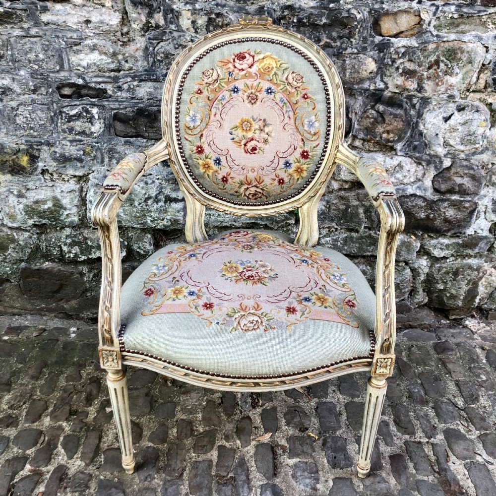 A late 19th century French Louis XVI style fauteuil 
