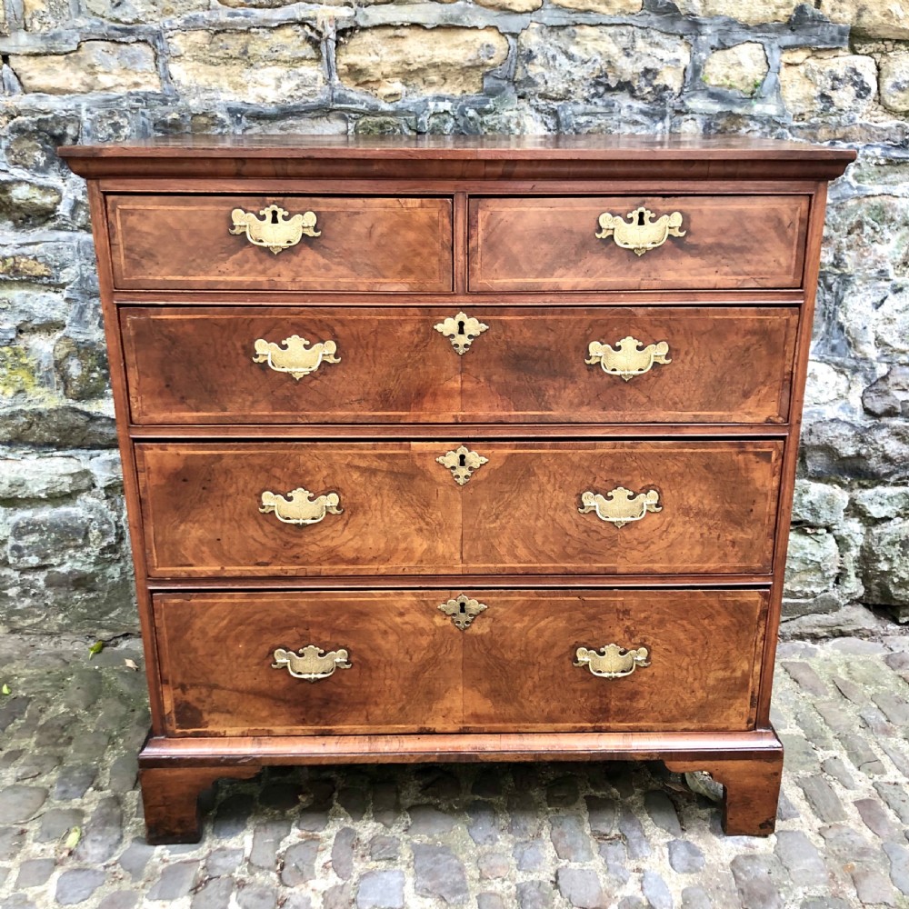 A George II walnut chest of drawers 