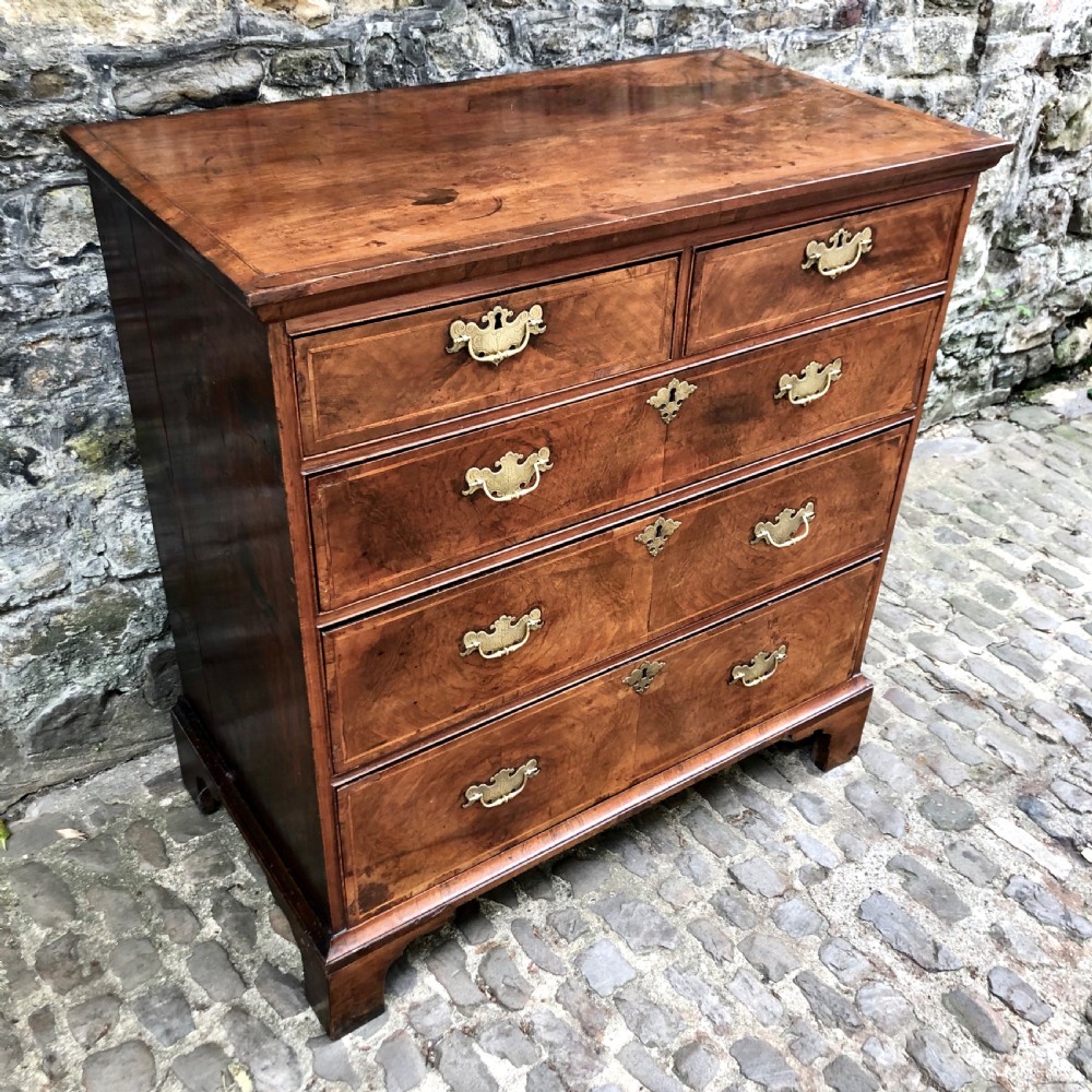 A George II walnut chest of drawers  View III