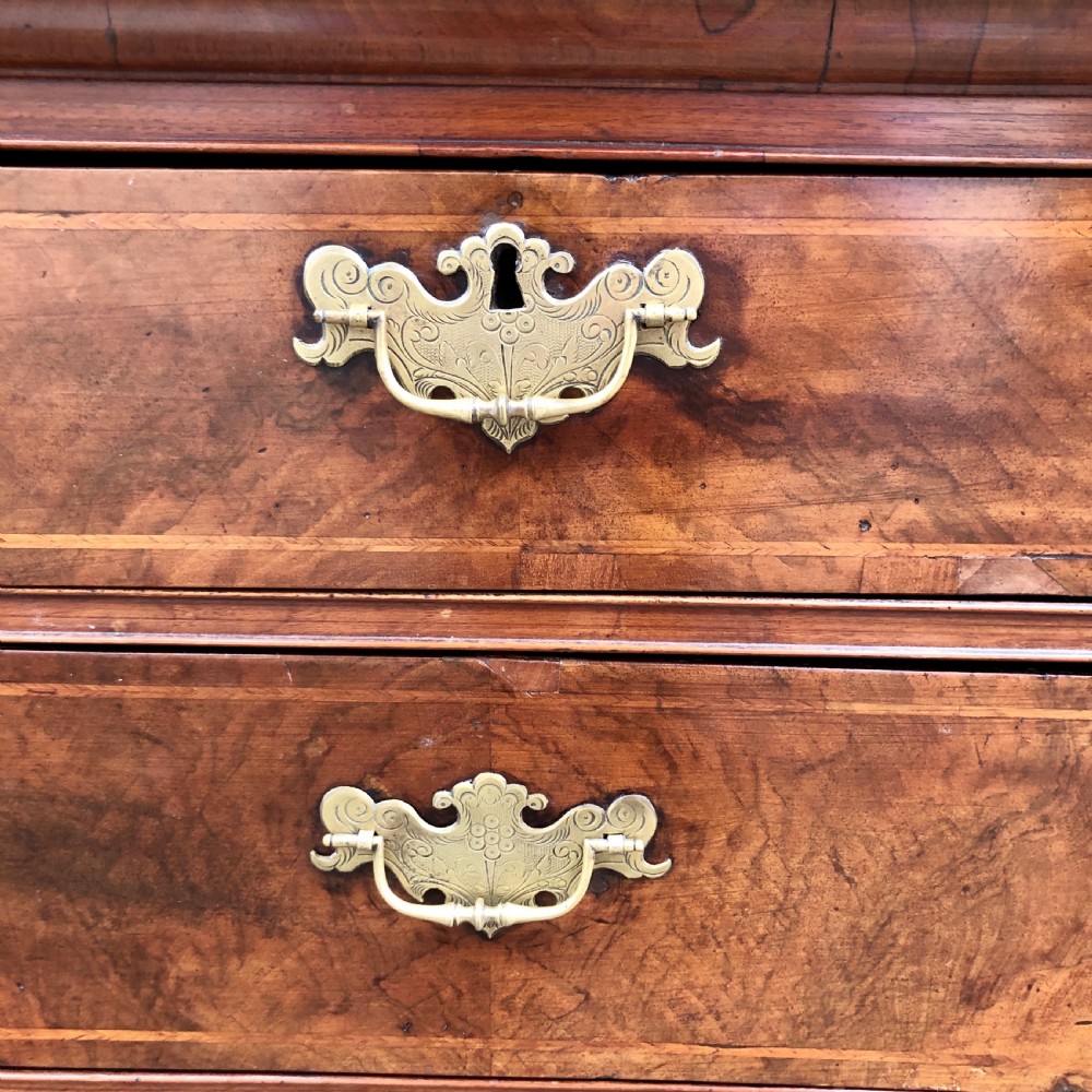 A George II walnut chest of drawers  View V