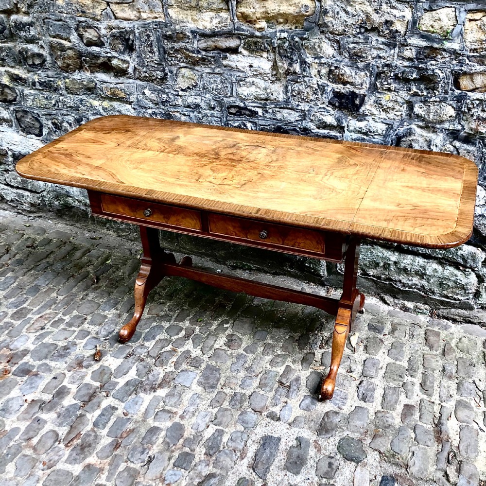 An early 20th century walnut sofa table by Heals View IV